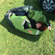 Pictured: E.A. Blackstock struggling singlehandedly with a tent because her friend showed up with a broken arm and could not help.